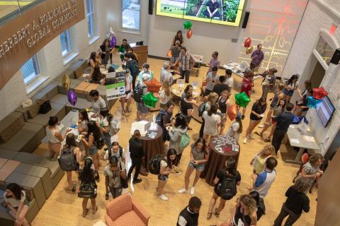 An overhead shot of the event showing students and faculty interacting
